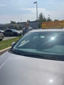 Young adult student giving a thumbs up