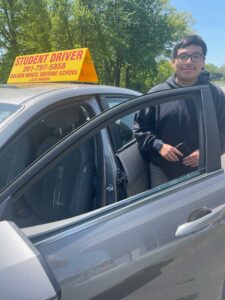 Instructor and student smiling in car