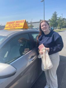 Happy teenage student with new permit