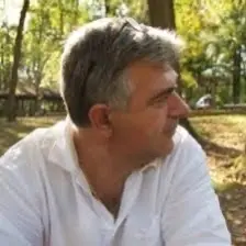 Driving school instructor sitting outdoors in a relaxed setting